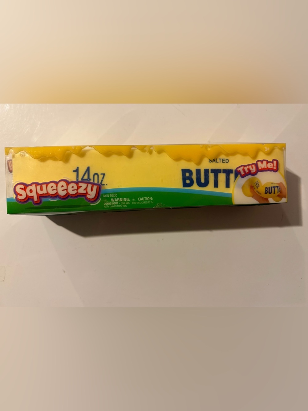 Yellow Butter Squeezy Plush Toy with Blue Logo